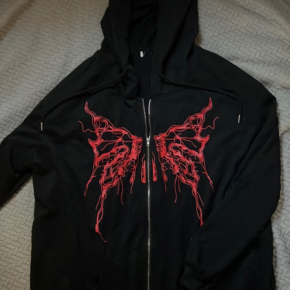 Black jacket with red butterfly